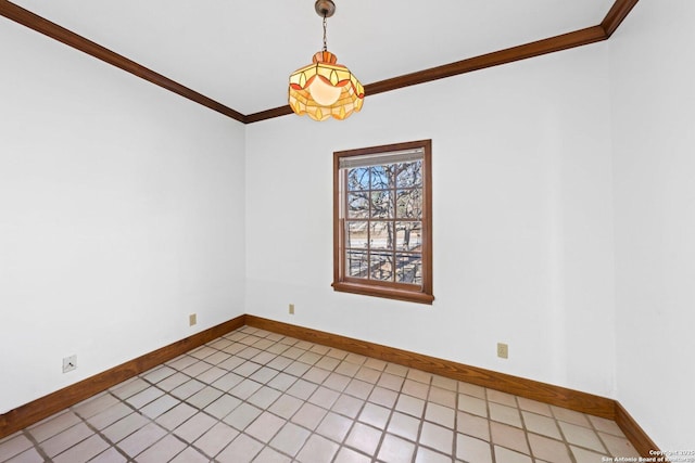 empty room with baseboards and ornamental molding