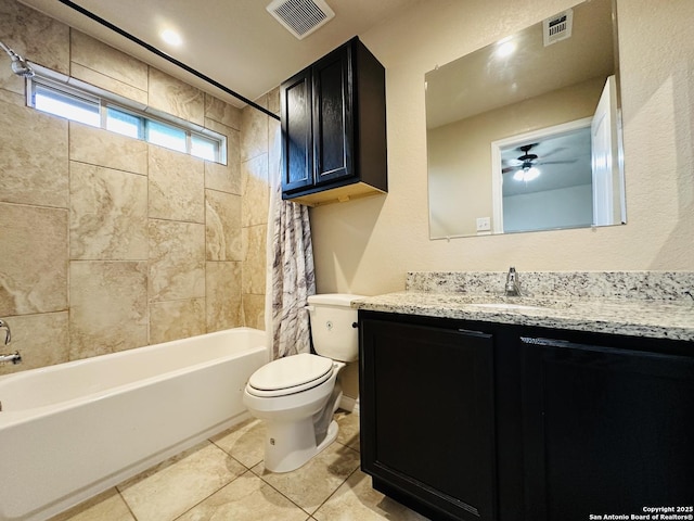 bathroom with toilet, shower / tub combo, visible vents, and vanity