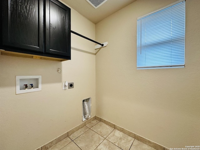 laundry area with washer hookup, light tile patterned floors, visible vents, cabinet space, and electric dryer hookup