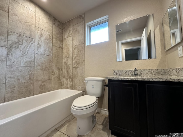 bathroom featuring washtub / shower combination, a textured wall, vanity, and toilet