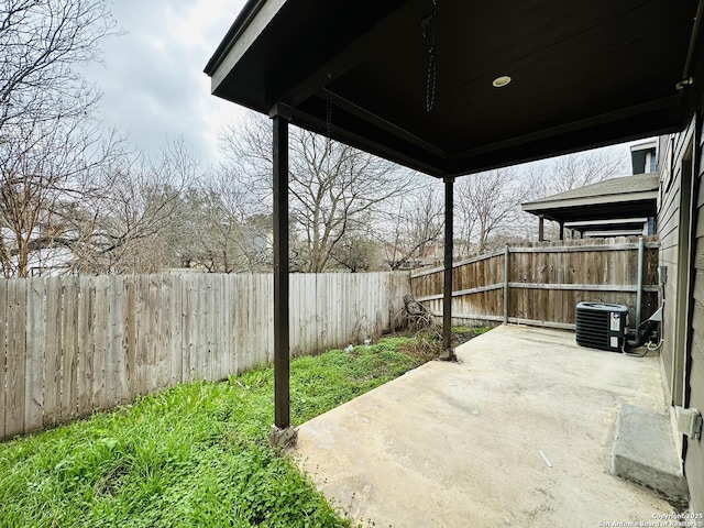 view of patio featuring central AC unit and a fenced backyard