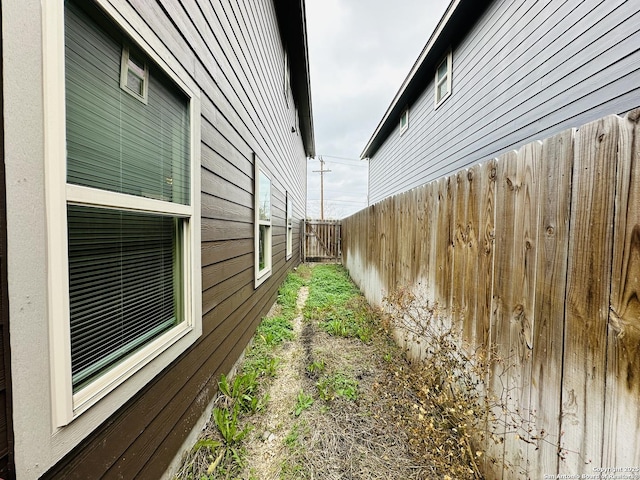 view of home's exterior featuring fence