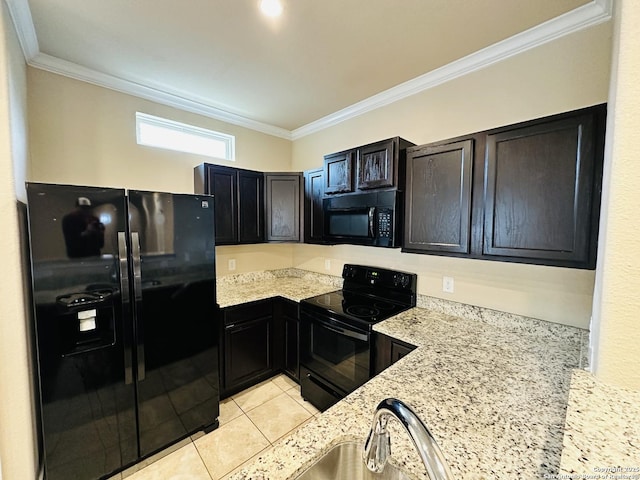 kitchen with black appliances, light tile patterned floors, light stone counters, and crown molding