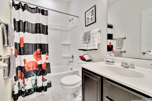 bathroom featuring toilet, shower / bath combo, vanity, and tile patterned floors