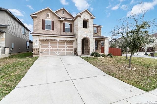 view of front facade with concrete driveway, an attached garage, fence, stone siding, and a front lawn