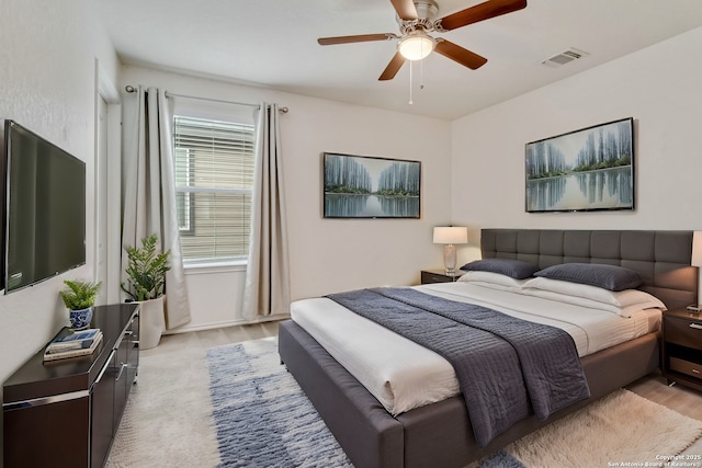 bedroom with a ceiling fan and visible vents