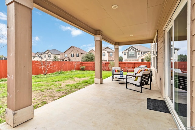 view of patio / terrace with a residential view, a fenced backyard, and outdoor lounge area