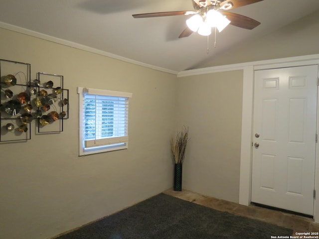 unfurnished room with ornamental molding, carpet, vaulted ceiling, and ceiling fan