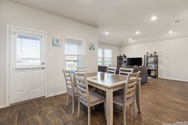 dining room featuring recessed lighting, dark wood-style flooring, visible vents, and baseboards