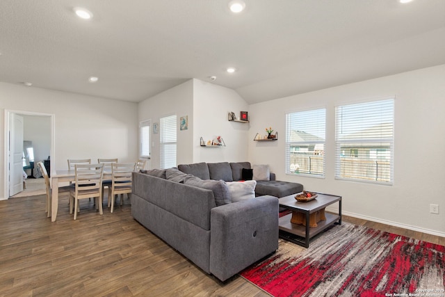 living room with recessed lighting, vaulted ceiling, baseboards, and wood finished floors