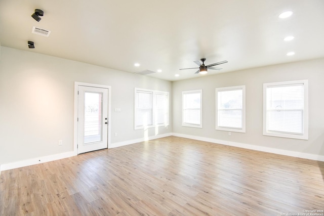 empty room featuring ceiling fan, recessed lighting, visible vents, baseboards, and light wood finished floors