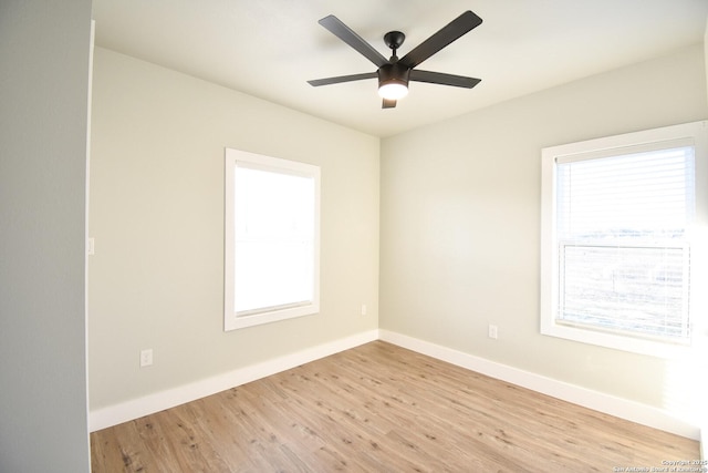 unfurnished room featuring light wood-style flooring, baseboards, and ceiling fan