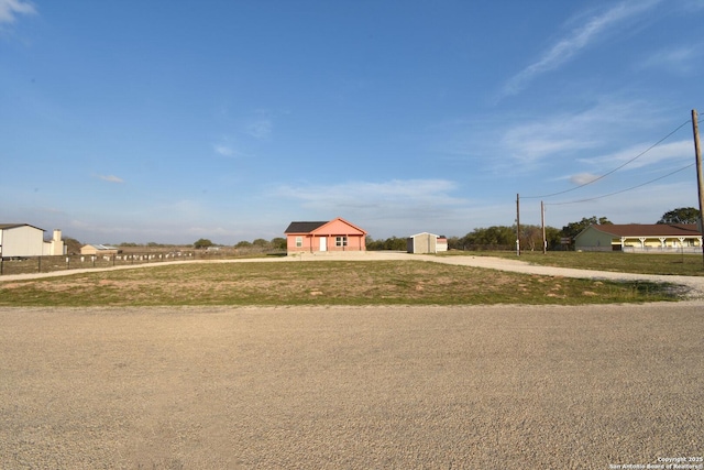 view of yard with a garage and driveway