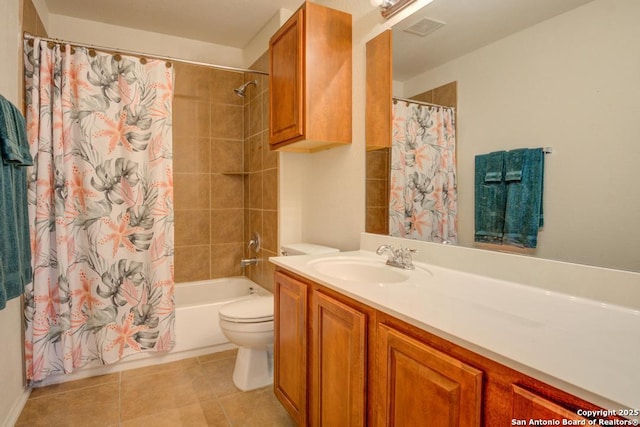 full bath with visible vents, toilet, tile patterned floors, shower / bath combo with shower curtain, and vanity