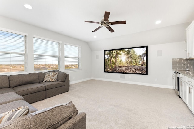 living room with recessed lighting, baseboards, and light colored carpet