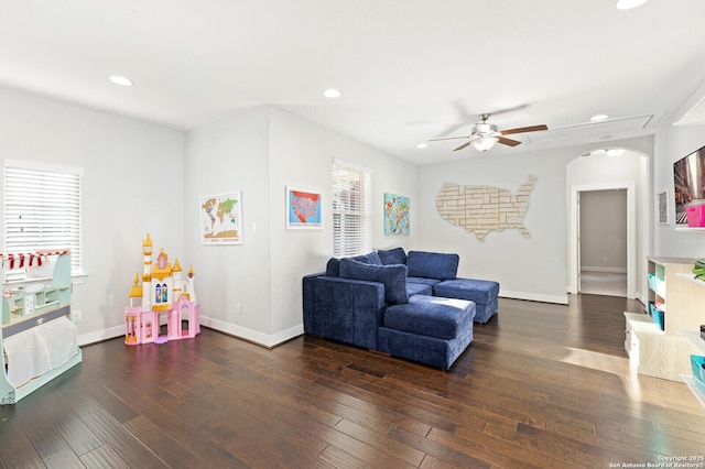 recreation room featuring arched walkways, wood finished floors, and recessed lighting