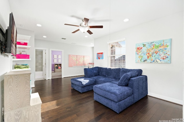 living area with baseboards, dark wood-type flooring, and recessed lighting