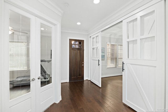 foyer entrance featuring recessed lighting, baseboards, french doors, dark wood finished floors, and crown molding