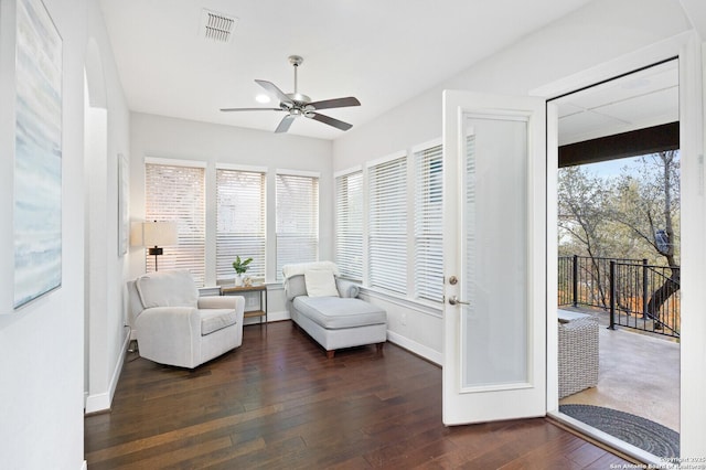 unfurnished room featuring ceiling fan, wood-type flooring, visible vents, and baseboards