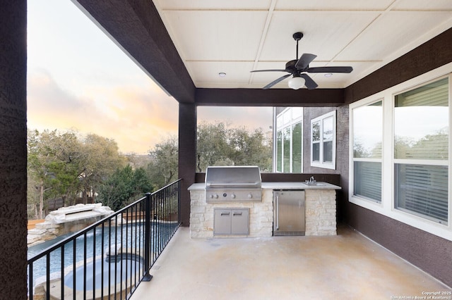 view of patio / terrace with a balcony, a ceiling fan, exterior kitchen, and area for grilling