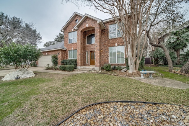 view of front of house featuring a garage, brick siding, and a front lawn