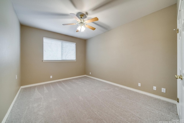 unfurnished room featuring baseboards, a ceiling fan, and light colored carpet