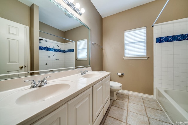 full bath with toilet, baseboards, a sink, and tile patterned floors