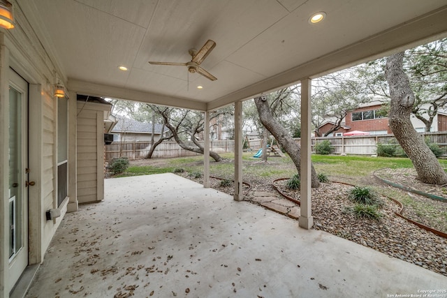 view of patio with a fenced backyard and ceiling fan