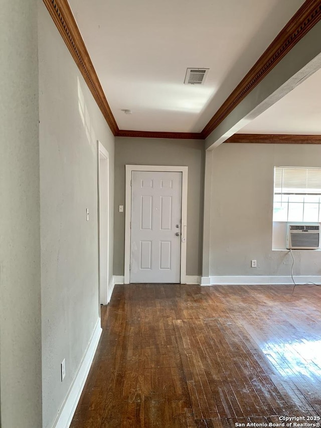 interior space with cooling unit, dark wood finished floors, visible vents, and crown molding