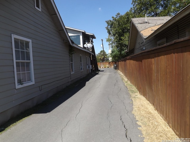 view of property exterior featuring fence