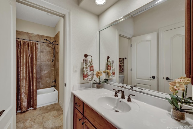 full bathroom featuring shower / bath combo with shower curtain and vanity