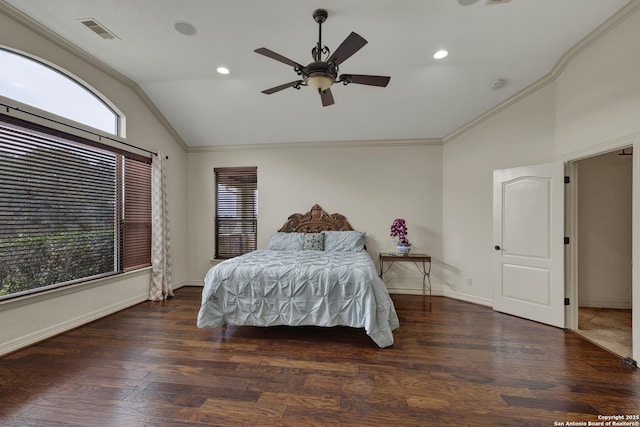 bedroom with lofted ceiling, visible vents, crown molding, and wood finished floors