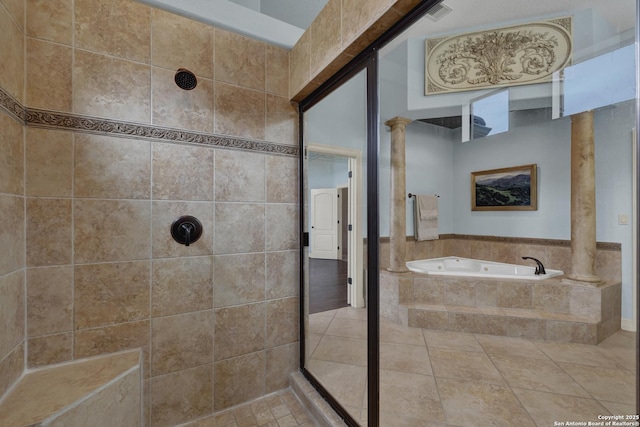 bathroom featuring ornate columns, visible vents, a tile shower, and a bath