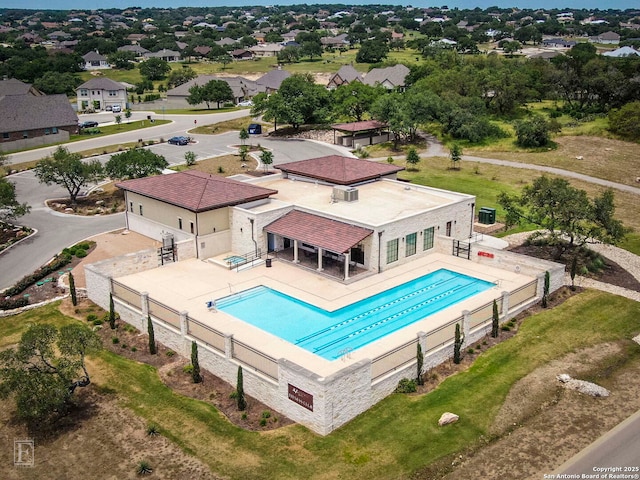 view of swimming pool with a fenced in pool, fence, and a patio