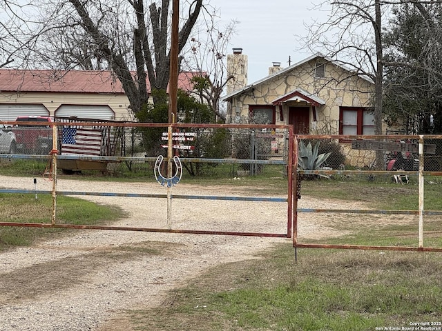 view of gate featuring a fenced front yard