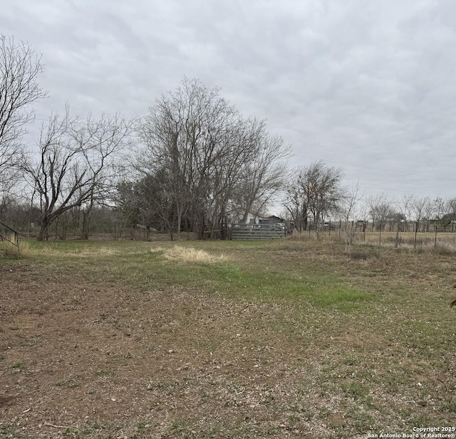 view of yard with a rural view