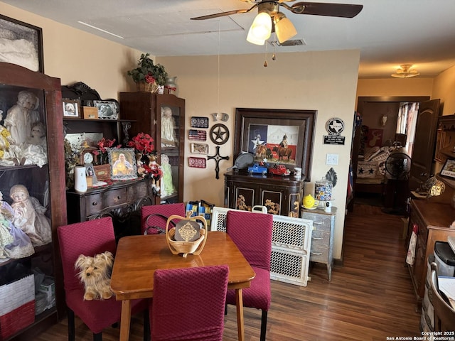 dining room featuring visible vents and dark wood finished floors