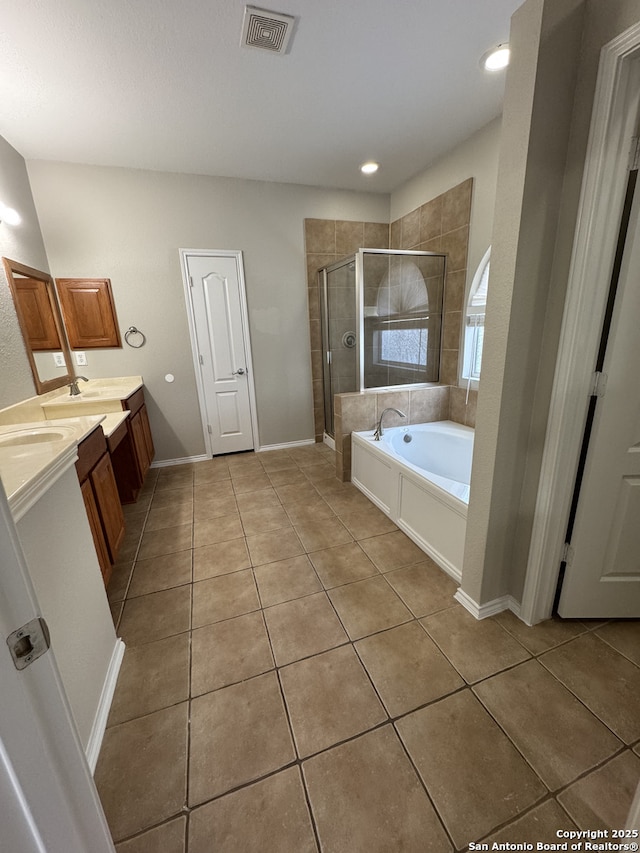 full bathroom with a garden tub, vanity, visible vents, tile patterned floors, and a stall shower