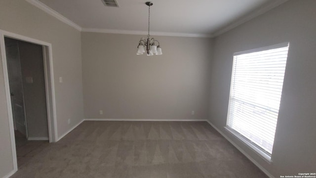 spare room featuring crown molding, baseboards, dark colored carpet, and a notable chandelier