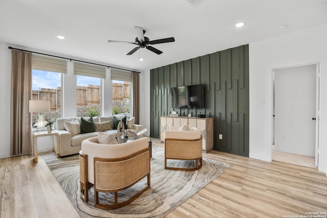 sitting room featuring baseboards, recessed lighting, a ceiling fan, and light wood-style floors