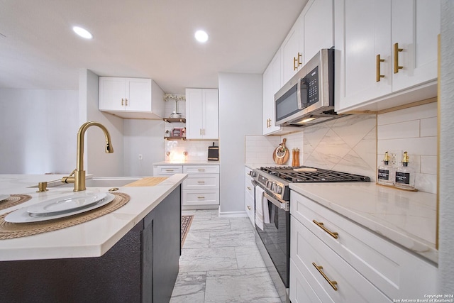 kitchen with white cabinets, open shelves, and stainless steel appliances