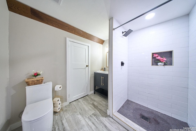 full bathroom with toilet, wood finished floors, a shower stall, and vanity