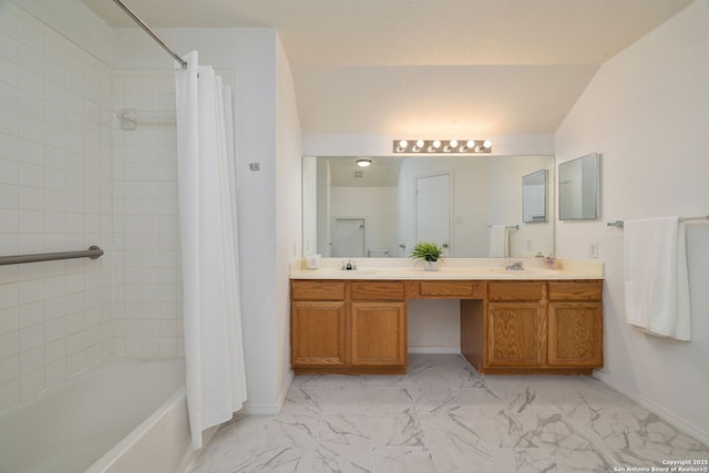 bathroom featuring double vanity, marble finish floor, shower / bath combo, and a sink