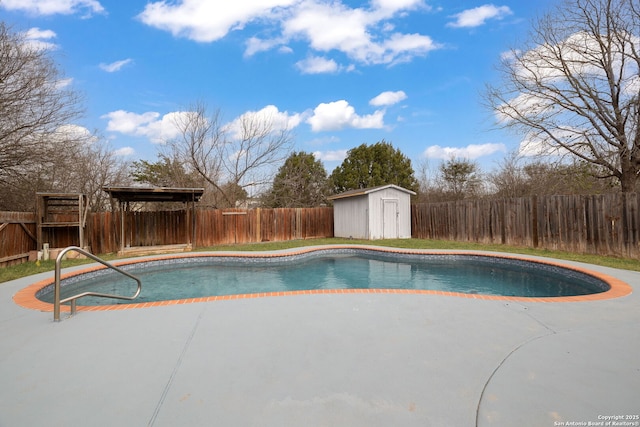 view of swimming pool featuring a fenced in pool, an outbuilding, a fenced backyard, and a storage unit