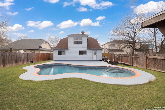 view of pool with a patio area, a fenced backyard, and a yard