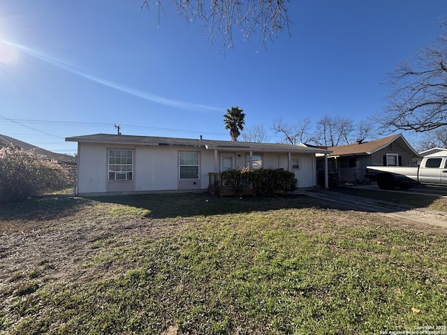 single story home with a front yard