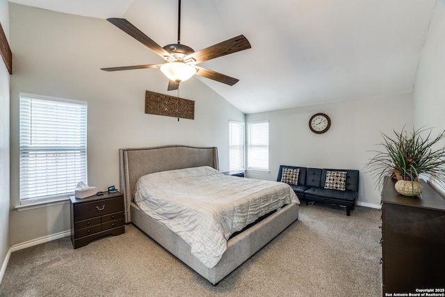 bedroom featuring light carpet, vaulted ceiling, and baseboards