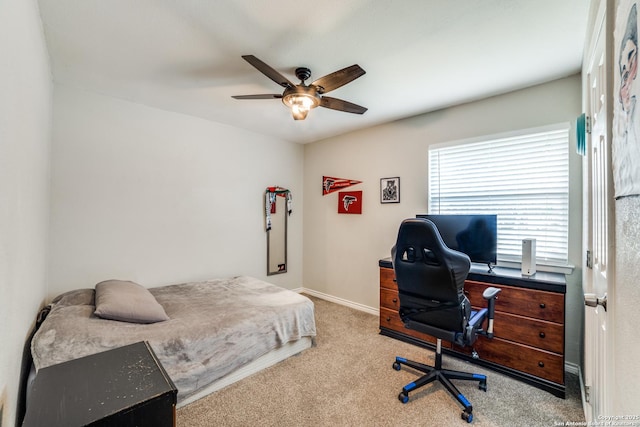 bedroom featuring baseboards, a ceiling fan, and light colored carpet