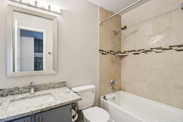 full bath featuring shower / bathtub combination, a textured ceiling, vanity, and toilet