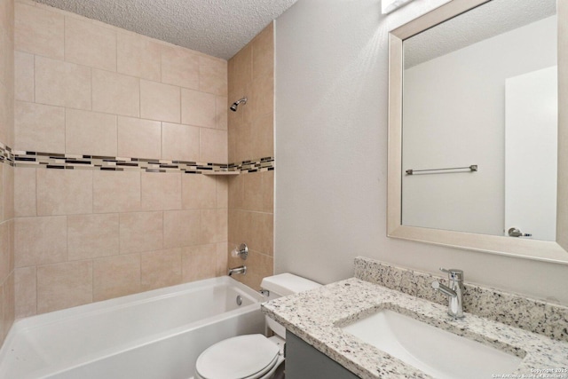 full bath with toilet,  shower combination, a textured ceiling, and vanity